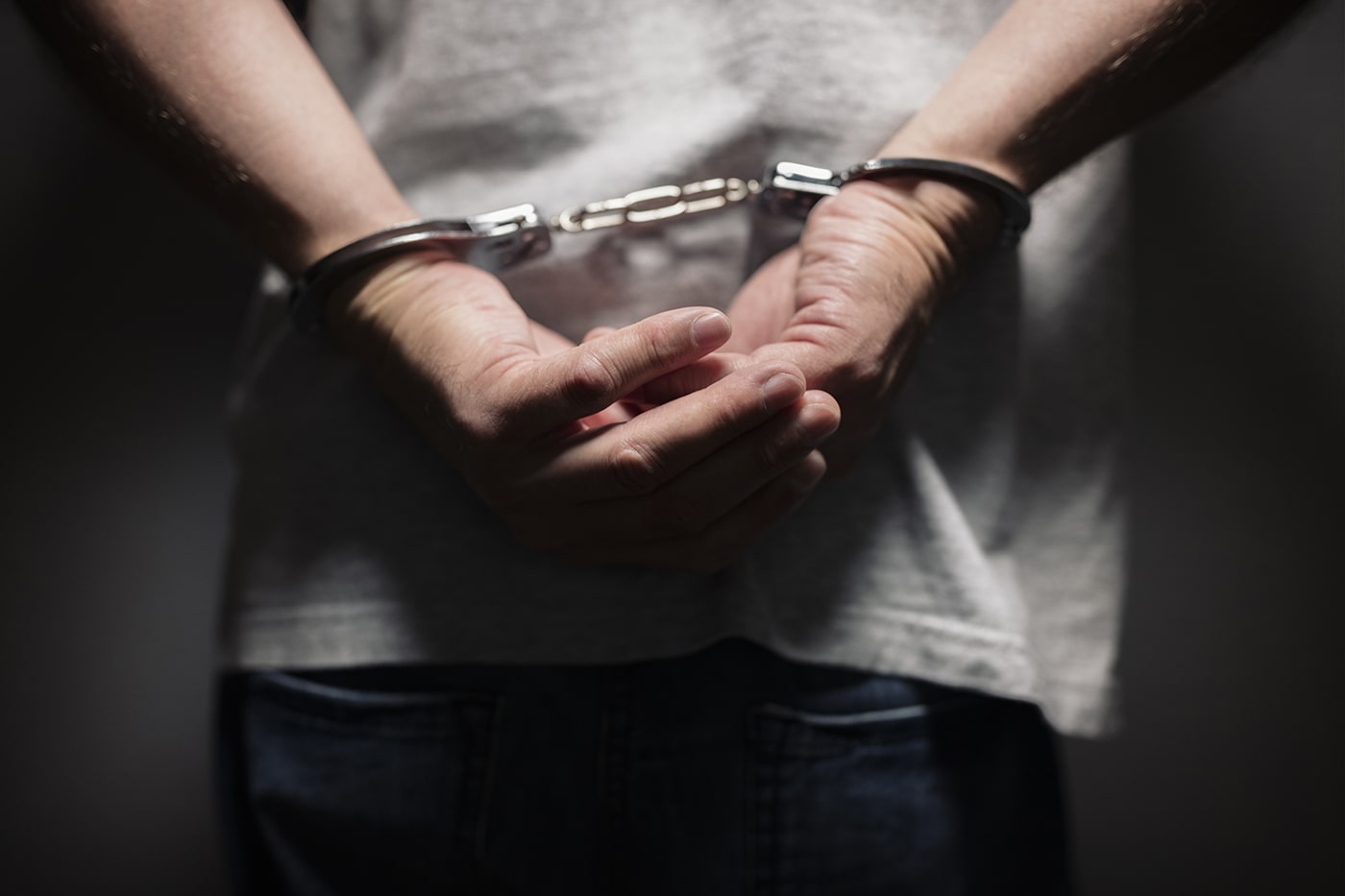 criminal-in-handcuffs-PTNKNY4-min.jpg
